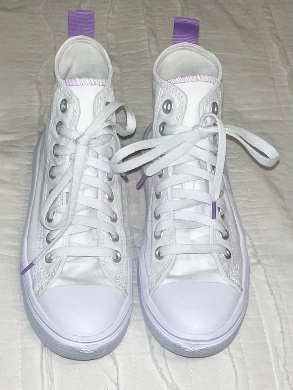 Converse High Top Sneakers in White with Purple Star Accent